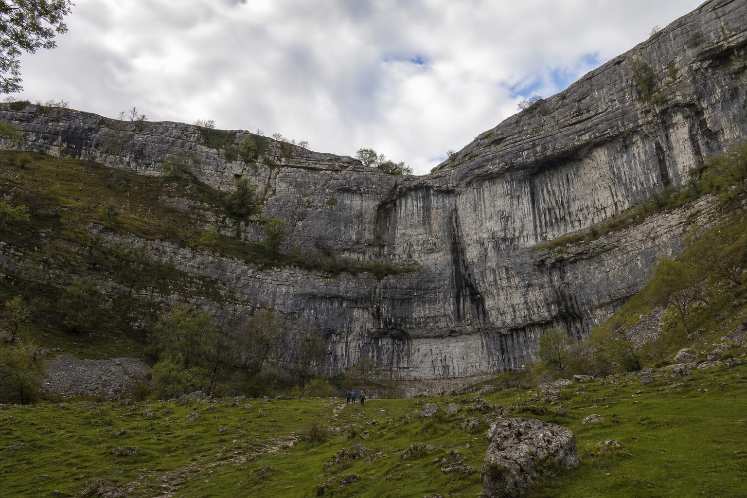 Curved limestone cliff face of Malham Cove